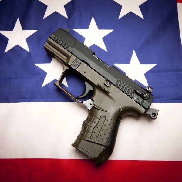 Handgun resting on an American flag