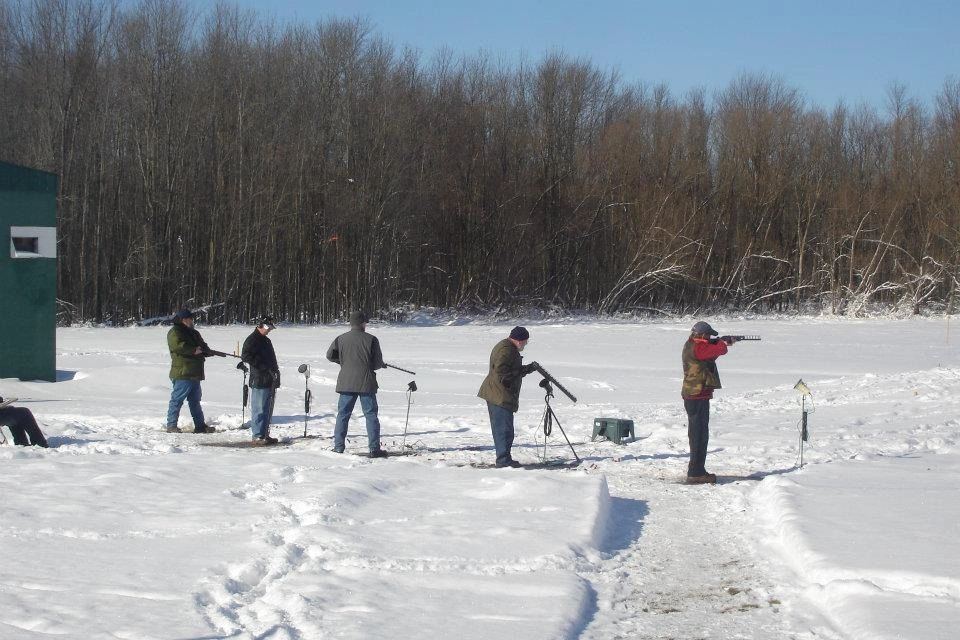 Shooters lined up on a snowy field